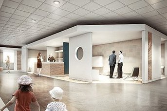 Ein modernes Empfangsbereich mit hellen Wänden und einem runden Fenster, in dem zwei Männer miteinander sprechen.